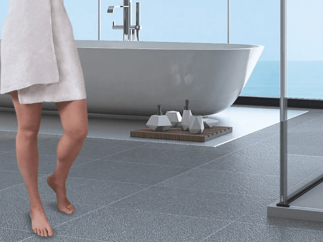 A person walking in front of a bathtub