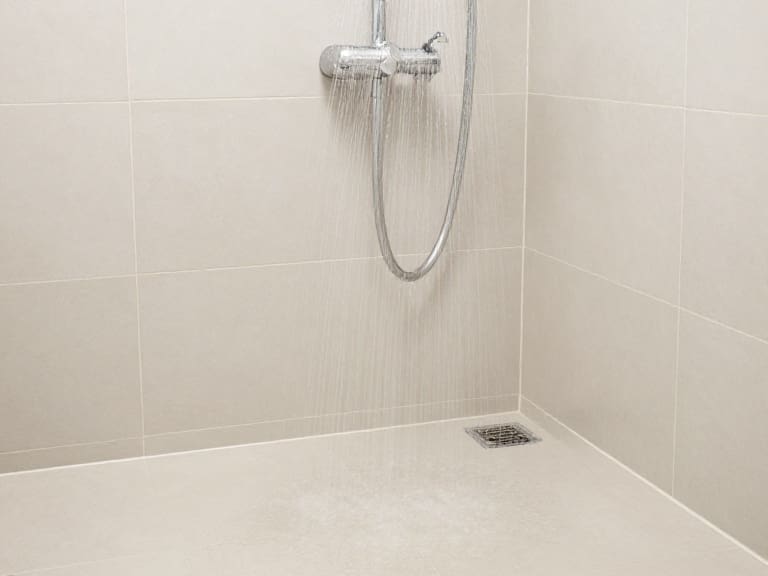 Why Does Water Pool on Your Shower Floor Even When You Have a Drain?